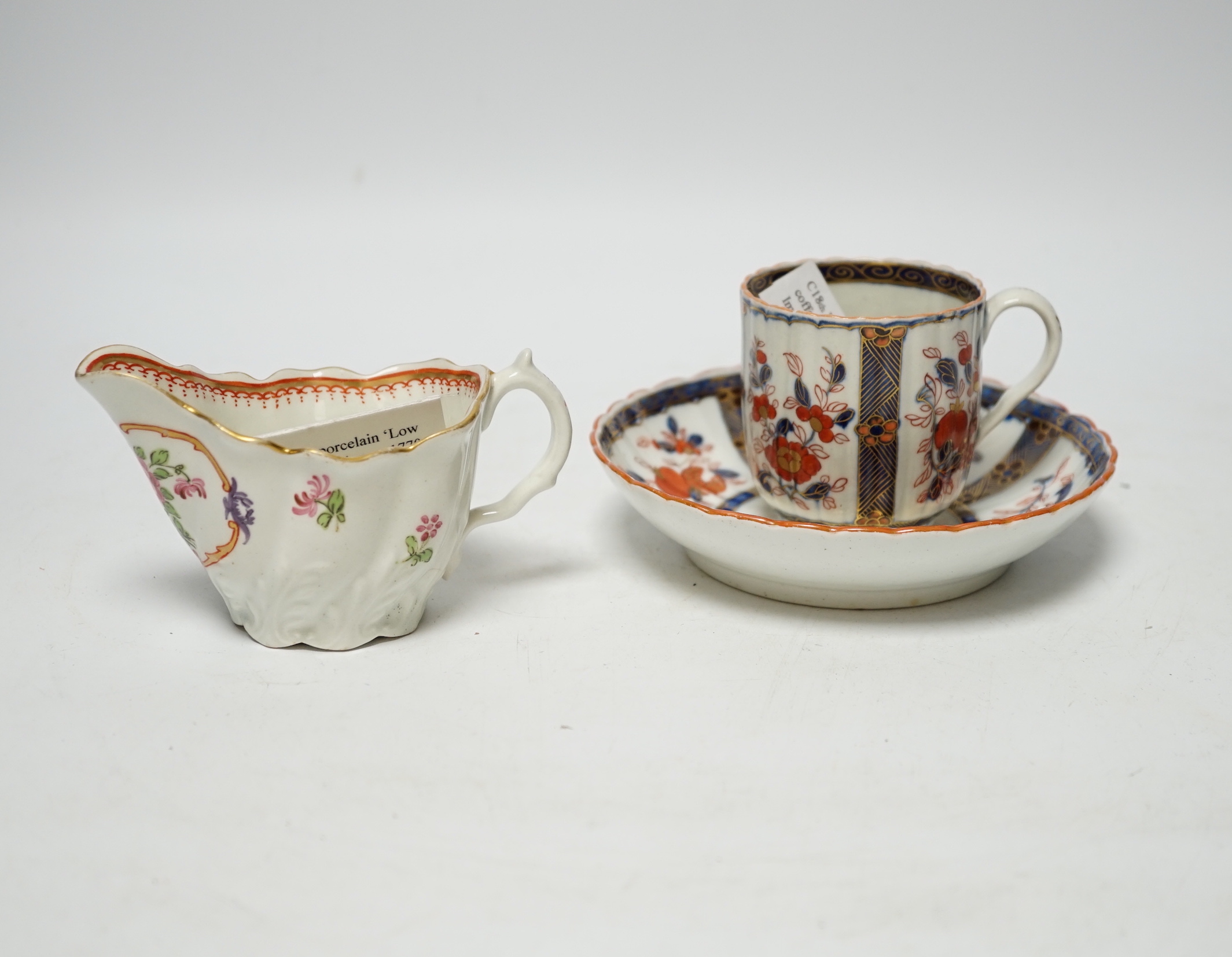 A Worcester ‘low Chelsea ewer’ milk jug, c.1770 and a Worcester Japan pattern coffee cup and saucer, c.1780, jug 6.5cm